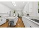 Spacious open-concept kitchen with a large island, quartz countertops, and great flow to the dining area at 216 Dairyland Rd, Chapel Hill, NC 27516