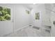 Spacious laundry room with utility sink, tile floors and exterior access at 216 Dairyland Rd, Chapel Hill, NC 27516