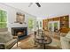 Inviting living room featuring a fireplace, natural light, and an open design at 216 Dairyland Rd, Chapel Hill, NC 27516