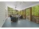 Spacious screened porch provides ample seating and panoramic views of the surrounding lush landscape, ideal for outdoor relaxation at 216 Dairyland Rd, Chapel Hill, NC 27516
