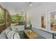 Relaxing screened porch, featuring a ceiling fan, comfortable seating, and plenty of room for entertaining guests at 216 Dairyland Rd, Chapel Hill, NC 27516