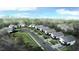 Modern community with contemporary home designs surrounded by trees with city skyline in the background at 2225 Millbank Village Ct # 101, Raleigh, NC 27610