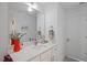 Clean bathroom with a white vanity, large mirror, and neutral decor at 2225 Millbank Village Ct # 101, Raleigh, NC 27610