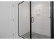 Bathroom features a black framed glass shower and modern tiling at 2225 Millbank Village Ct # 101, Raleigh, NC 27610