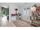 Cozy bedroom with light floors, a patterned rug, and access to a separate living space at 2225 Millbank Village Ct # 101, Raleigh, NC 27610