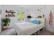 Bright bedroom with a comfortable bed, lots of light, and decorative wall hangings at 2225 Millbank Village Ct # 101, Raleigh, NC 27610