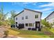 Modern two-story home with sleek siding, black accents, and a neatly landscaped backyard at 2225 Millbank Village Ct # 101, Raleigh, NC 27610