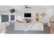 Cozy living room featuring a comfortable gray sofa, a modern entertainment center, and lots of natural light at 2225 Millbank Village Ct # 101, Raleigh, NC 27610