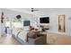 Comfortable living room featuring modern decor, hardwood floors, a large sectional and lots of natural light at 2225 Millbank Village Ct # 101, Raleigh, NC 27610