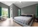 Large main bedroom boasts modern design and features a private balcony at 2225 Millbank Village Ct # 101, Raleigh, NC 27610