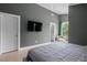 Bright main bedroom boasting high ceilings and features a private balcony and ensuite bathroom at 2225 Millbank Village Ct # 101, Raleigh, NC 27610