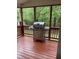 View of back porch with grill and wood railing at 2305 Summit Dr, Hillsborough, NC 27278