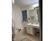 Bathroom featuring a tub with tile flooring, single sink vanity, and natural light from window at 2305 Summit Dr, Hillsborough, NC 27278
