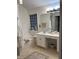 Bathroom featuring a tub with tile flooring, single sink vanity, and natural light from window at 2305 Summit Dr, Hillsborough, NC 27278