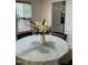 Bright breakfast nook boasts natural light, a round table, and views of the outdoors at 2305 Summit Dr, Hillsborough, NC 27278