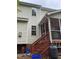 Exterior view of home with wood stairs and screened-in porch at 2305 Summit Dr, Hillsborough, NC 27278