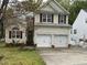 Lovely two-story home with two-car garage, brick detail, and a welcoming front yard and landscaping at 2305 Summit Dr, Hillsborough, NC 27278