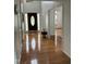 Inviting foyer with gleaming hardwood floors and a view into other rooms at 2305 Summit Dr, Hillsborough, NC 27278