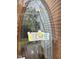 A decorative 'Welcome' sign hanging on an ornate oval-paned front door at 2305 Summit Dr, Hillsborough, NC 27278