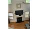 Bright living room features hardwood floors, a fireplace, and large windows at 2305 Summit Dr, Hillsborough, NC 27278