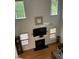 Bright living room features hardwood floors, a fireplace, and large windows at 2305 Summit Dr, Hillsborough, NC 27278