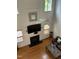 Bright living room features hardwood floors, a fireplace, and large windows at 2305 Summit Dr, Hillsborough, NC 27278