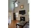 Bright living room features hardwood floors, a fireplace, and large windows at 2305 Summit Dr, Hillsborough, NC 27278