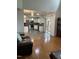 Hardwood living room offering an inviting transition to an open kitchen area with natural light at 2305 Summit Dr, Hillsborough, NC 27278
