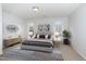 Serene bedroom featuring a large bed, neutral decor, ample natural light, and stylish furnishings at 2411 Vancastle Way # 202, Raleigh, NC 27617