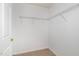 Walk-in closet with white walls and carpeted floors, offers plenty of storage space at 2411 Vancastle Way # 202, Raleigh, NC 27617