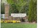 Stone entrance sign for Avera Place community, surrounded by lush landscaping at 2411 Vancastle Way # 202, Raleigh, NC 27617