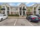 Apartment building exterior with parking spaces at 2411 Vancastle Way # 202, Raleigh, NC 27617