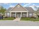 Exterior shot of the Information Center with beautiful landscaping at 2411 Vancastle Way # 202, Raleigh, NC 27617