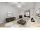 Bright living room featuring a fireplace, neutral tones, elegant furnishings, and seamless flow into the adjacent room at 2411 Vancastle Way # 202, Raleigh, NC 27617