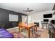 Multipurpose dining area with custom decor accents, a fireplace, and black accent wall at 2522 N Roxboro St, Durham, NC 27704