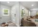 Bright entryway featuring a modern white door with glass panels and light wood-look flooring at 2522 N Roxboro St, Durham, NC 27704