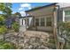 Inviting covered front porch with wood railings, offering a cozy spot to relax and enjoy the neighborhood views at 2522 N Roxboro St, Durham, NC 27704