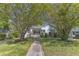 Charming home with a walkway leading to the front porch and beautiful trees providing shade at 2522 N Roxboro St, Durham, NC 27704