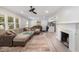 Spacious living room showcasing a fireplace, sectional sofa, and light wood-look flooring at 2522 N Roxboro St, Durham, NC 27704