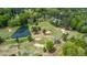 Scenic aerial view of a lush golf course community with a tranquil pond at 254 Pine Forest Dr, Siler City, NC 27344