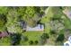 Aerial view of the property showcasing the house, manicured lawns, a shed and driveway at 254 Pine Forest Dr, Siler City, NC 27344