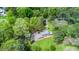 Overhead view capturing a home with lush surroundings and a convenient outbuilding at 254 Pine Forest Dr, Siler City, NC 27344