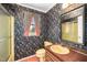 Bathroom with patterned wallpaper at 254 Pine Forest Dr, Siler City, NC 27344