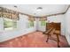 Cozy bedroom features floral accents, white shutters, and charming antique table at 254 Pine Forest Dr, Siler City, NC 27344