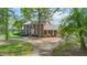 Landscaped brick home on a large lot with mature trees at 254 Pine Forest Dr, Siler City, NC 27344