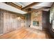Unique living space featuring a brick fireplace and wooden accents throughout at 254 Pine Forest Dr, Siler City, NC 27344
