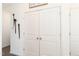 Bright hallway featuring white doors and baseboards, with durable wood-look flooring at 290 Deodora Ln, Cameron, NC 28326