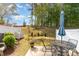 Fenced backyard with a patio table and chairs for entertaining at 301 White Oak Ridge Dr, Garner, NC 27529