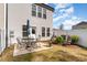 Backyard features a patio table and chairs, plus a few lounge chairs and small landscaping at 301 White Oak Ridge Dr, Garner, NC 27529