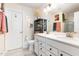 Bathroom with double vanity, framed mirrors, and decorative accents offers plenty of storage and style at 301 White Oak Ridge Dr, Garner, NC 27529